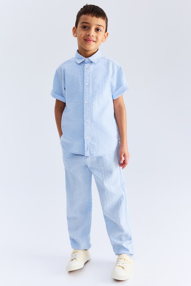 Брюки из хлопчатобумажной ткани сирсакер H&M, голубой
Брюки из хлопчатобумажной ткани сирсакер H&M, голубой