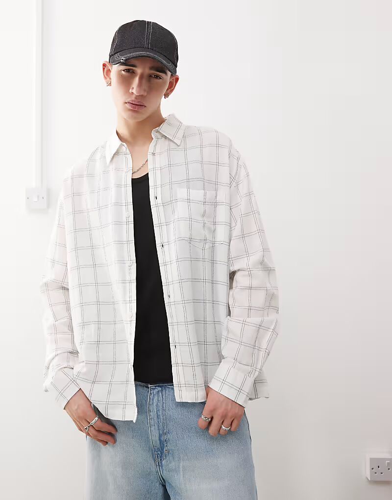 Рубашка свободного кроя с длинными рукавами в будничном стиле в мелкую белую клетку Weekday
Рубашка свободного кроя с длинными рукавами в будничном стиле в мелкую белую клетку Weekday