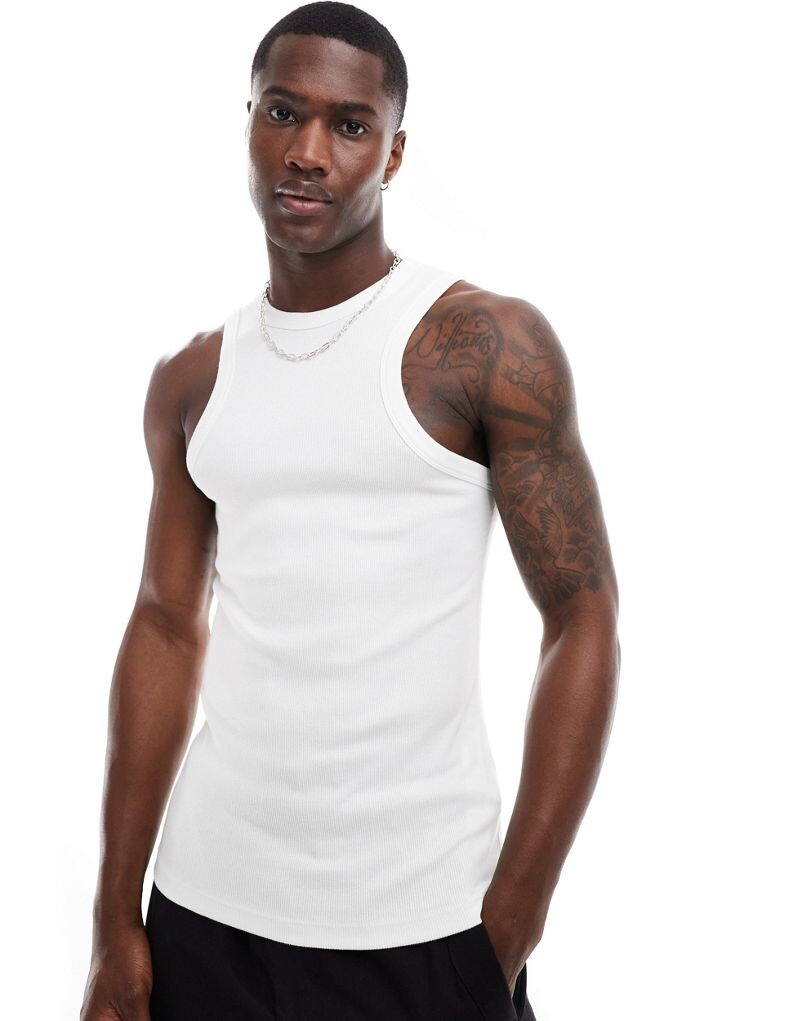 Белая майка в рубчик с облегающим кроем ASOS DESIGN
Белая майка в рубчик с облегающим кроем ASOS DESIGN