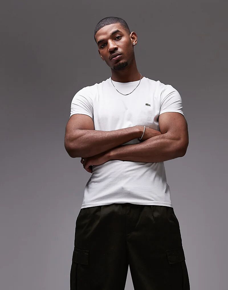 Футболка из хлопка пима белого цвета Lacoste
Футболка из хлопка пима белого цвета Lacoste