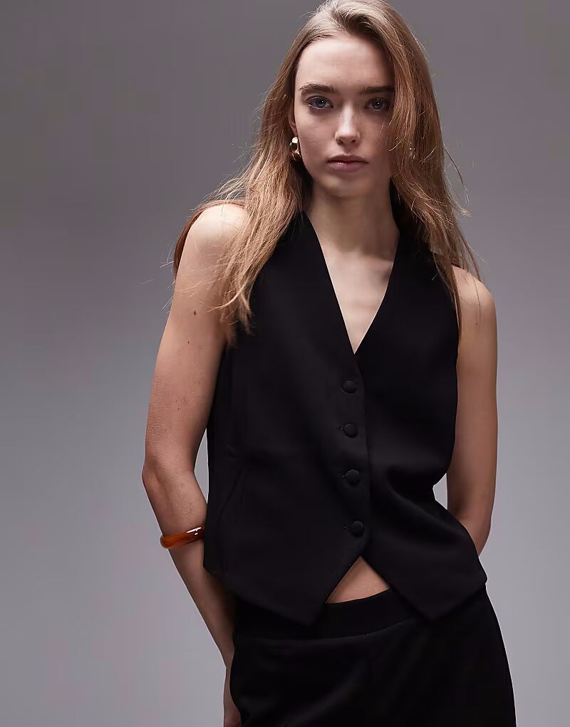 Строгий жилет черного цвета Mango
Строгий жилет черного цвета Mango