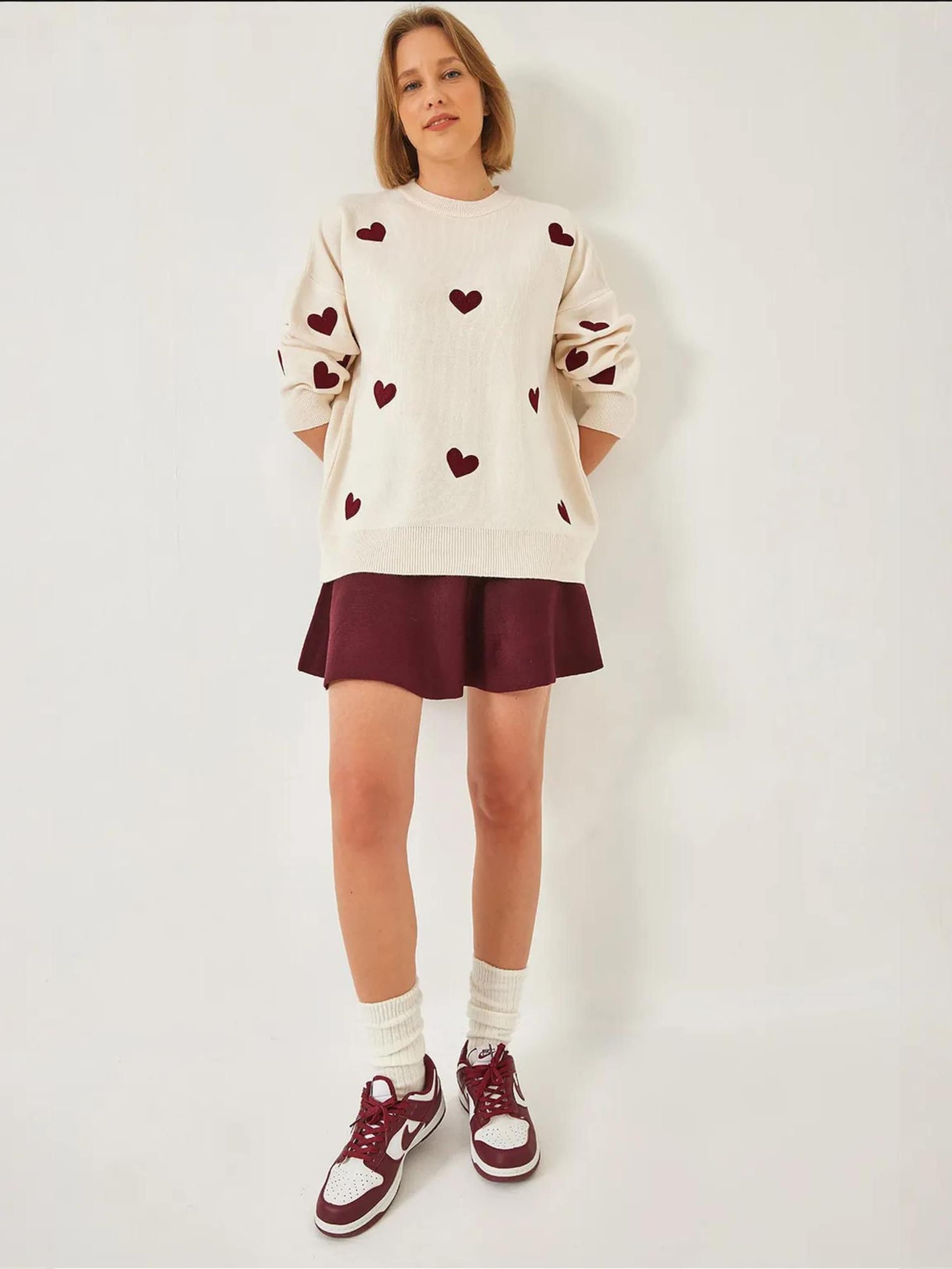 Bianco Lucci Свитер оверсайз в цвете экрю
Bianco Lucci Свитер оверсайз в цвете экрю