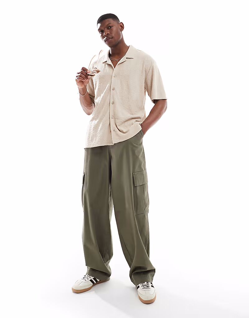 Потертая фактурная рубашка с короткими рукавами в каменном цвете Threadbare
Потертая фактурная рубашка с короткими рукавами в каменном цвете Threadbare