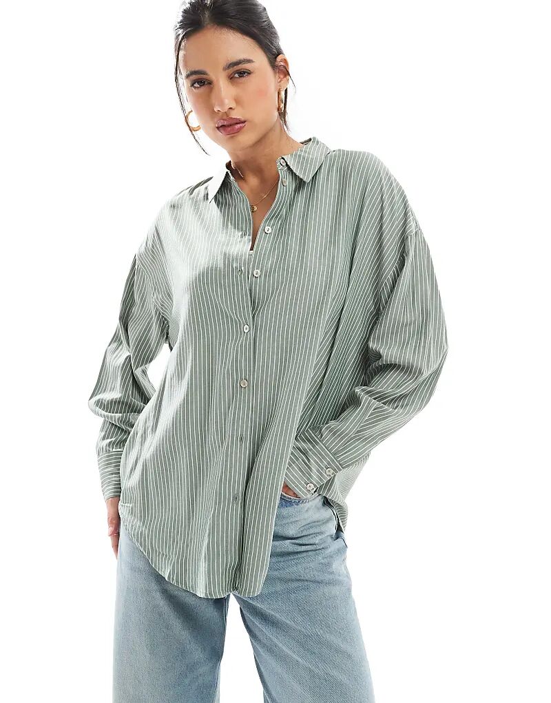 Рубашка оверсайз Vero Moda в зелено-белую полоску
Рубашка оверсайз Vero Moda в зелено-белую полоску