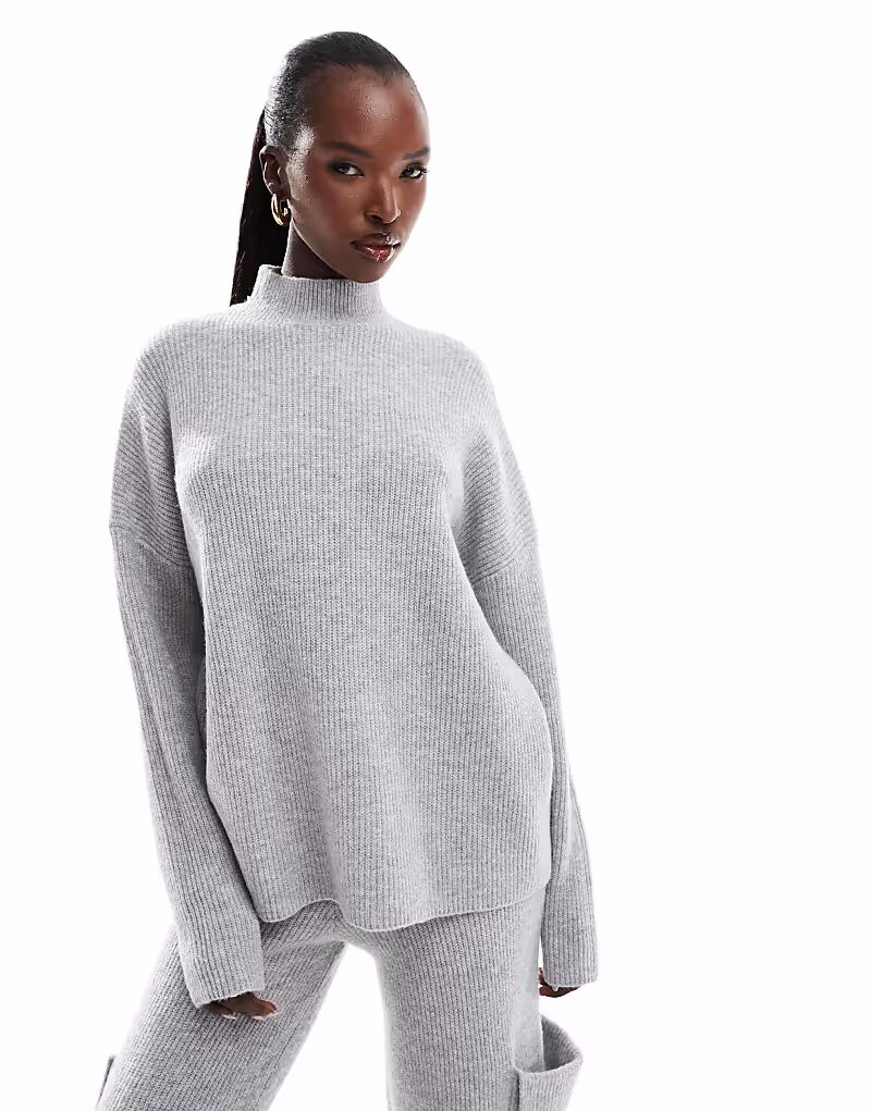 Вязаный джемпер Aria Cove с высоким воротом, светло-серый
Вязаный джемпер Aria Cove с высоким воротом, светло-серый