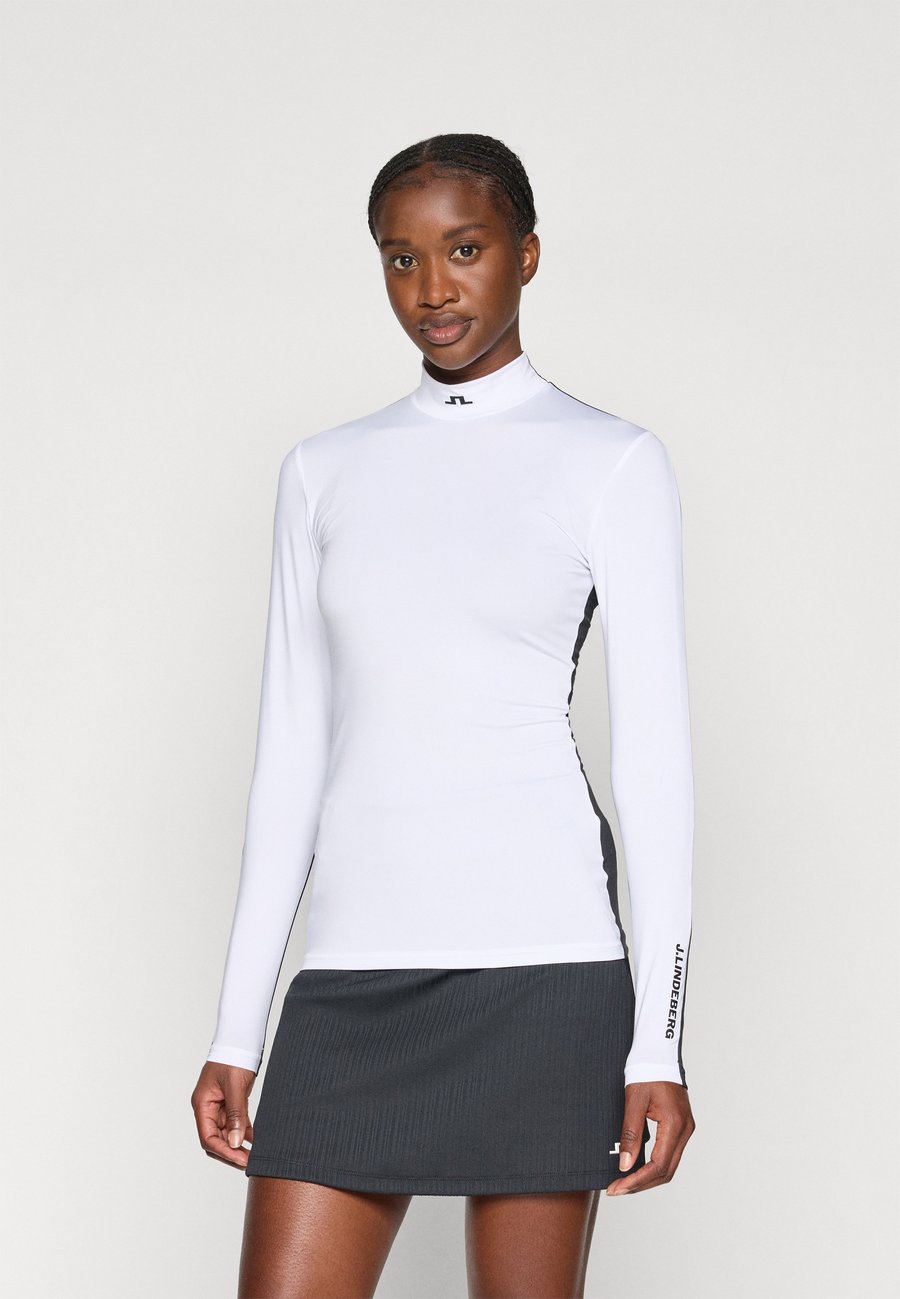 Топ J.LINDEBERG Sports HALLIE COMPRESSION TOP, White
Топ J.LINDEBERG Sports HALLIE COMPRESSION TOP, White