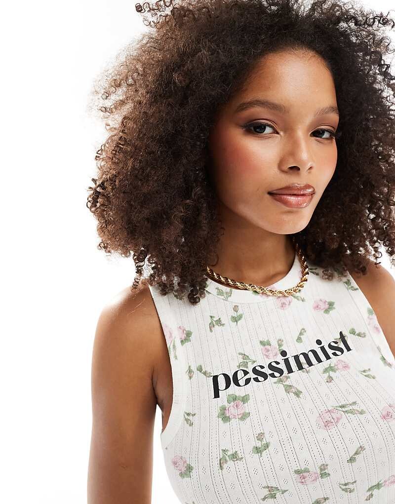 Майка ASOS DESIGN с цветочным принтом по всей поверхности и «пессимистическим» рисунком
Майка ASOS DESIGN с цветочным принтом по всей поверхности и «пессимистическим» рисунком