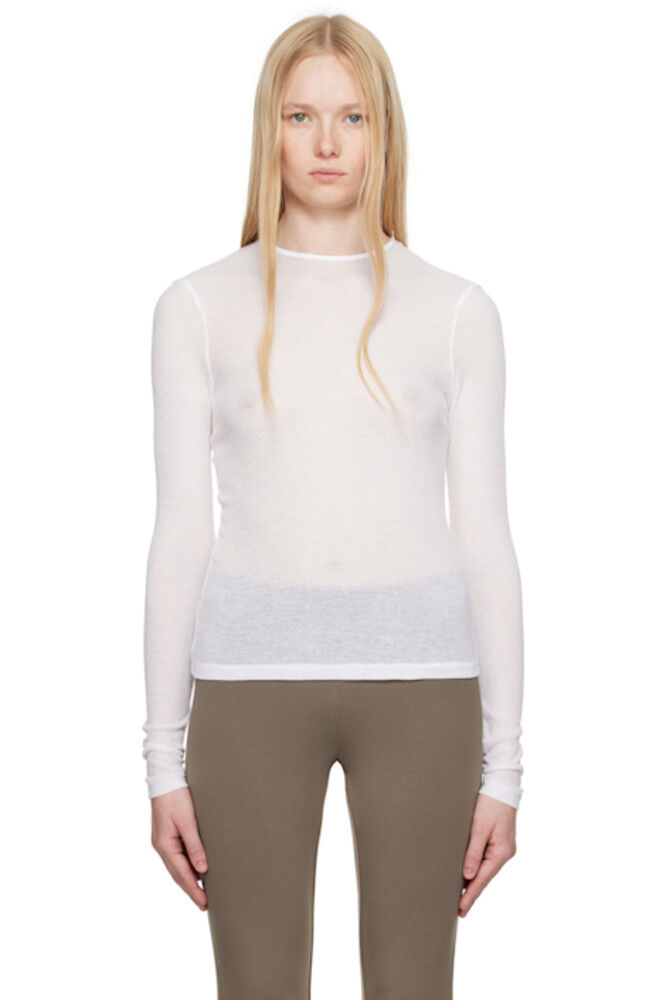 Белая прозрачная хлопковая футболка с длинным рукавом SKIMS
Белая прозрачная хлопковая футболка с длинным рукавом SKIMS