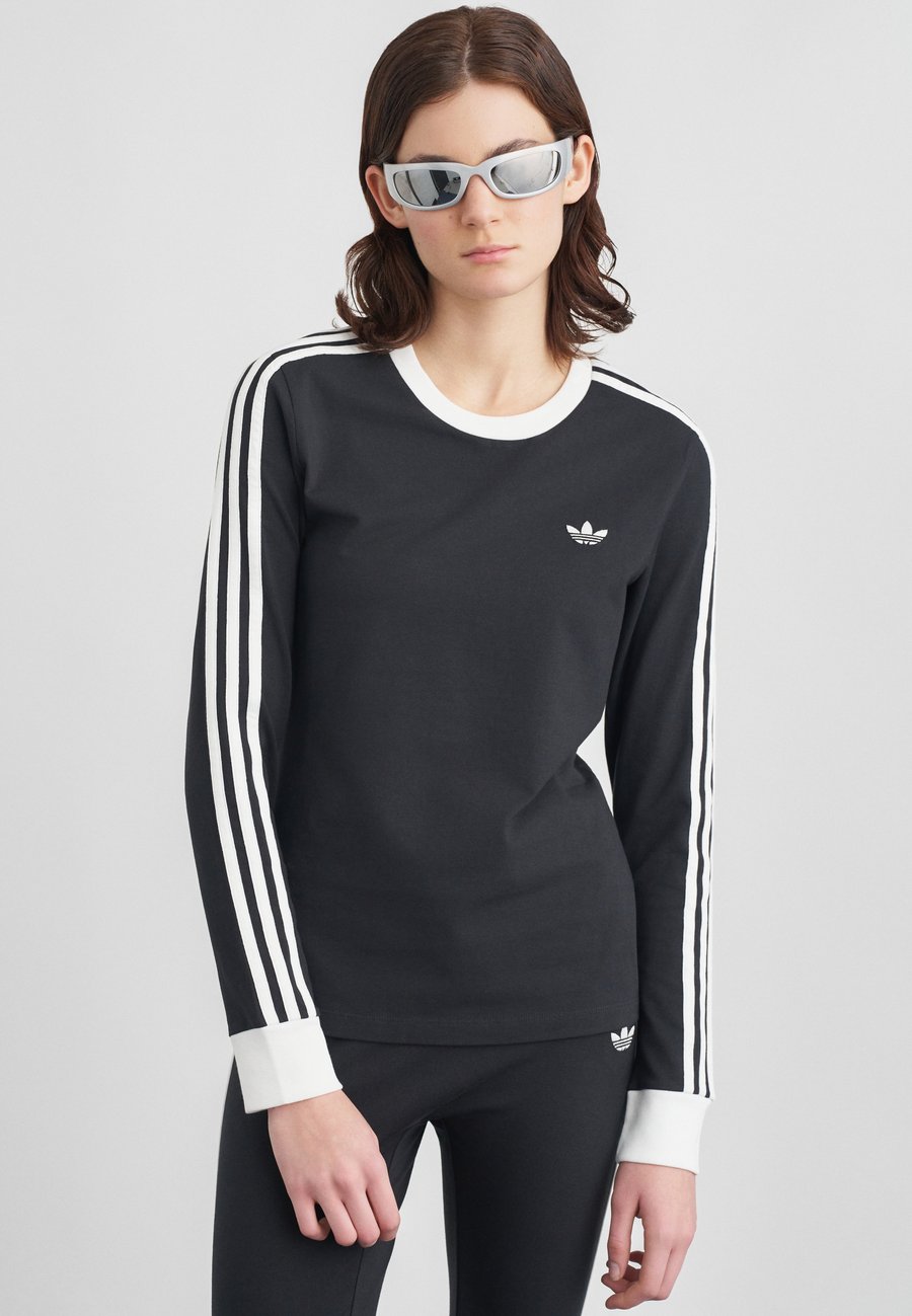 Топ Adidas Originals LONGLSEEVE, Black/White/Black
Топ Adidas Originals LONGLSEEVE, Black/White/Black