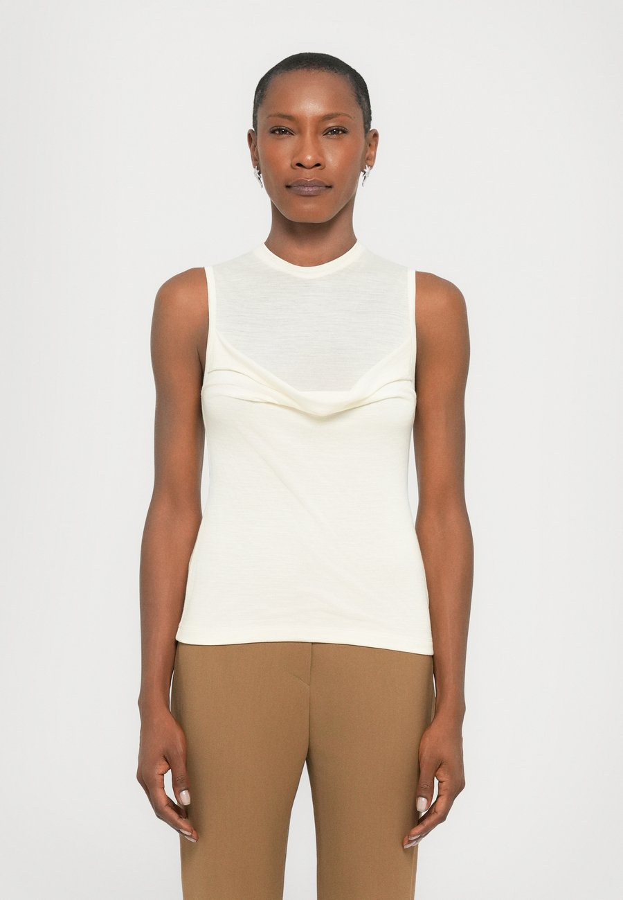 Топ Nanushka ORIEN, Creme/Off-White
Топ Nanushka ORIEN, Creme/Off-White