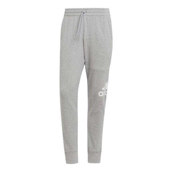 Брюки Essentials из французского трикотажа с зауженными манжетами и логотипом Adidas, серый
Брюки Essentials из французского трикотажа с зауженными манжетами и логотипом Adidas, серый