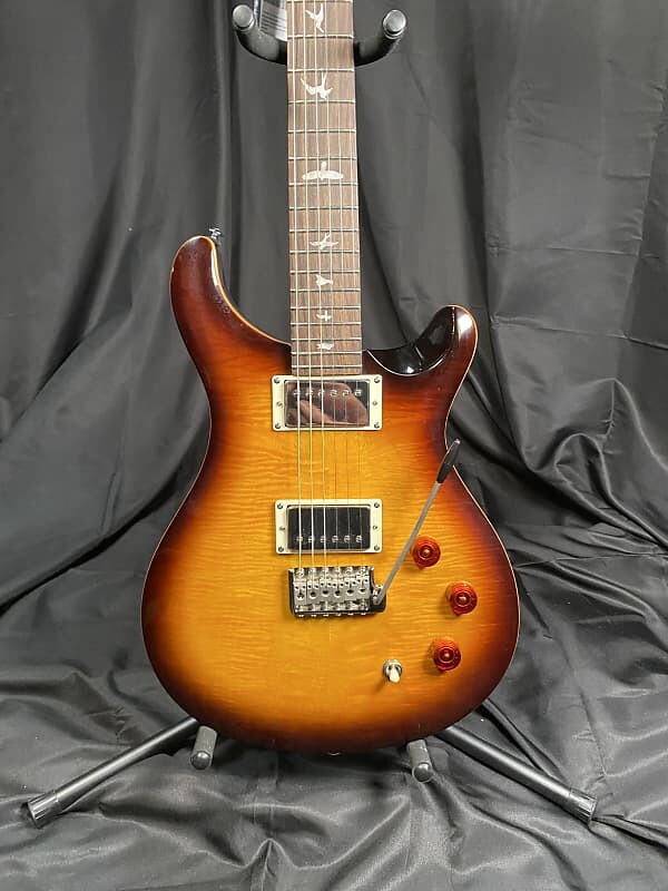 Электрогитара PRS SE DGT David Grissom Signature Solidbody Electric Guitar - McCarty Tabacco Sunburst
Электрогитара PRS SE DGT David Grissom Signature Solidbody Electric Guitar - McCarty Tabacco Sunburst