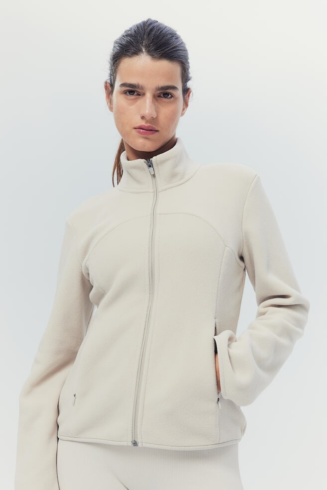 Спортивная флисовая куртка из материала drymove H&M, бежевый 
Спортивная флисовая куртка из материала drymove H&M, бежевый
