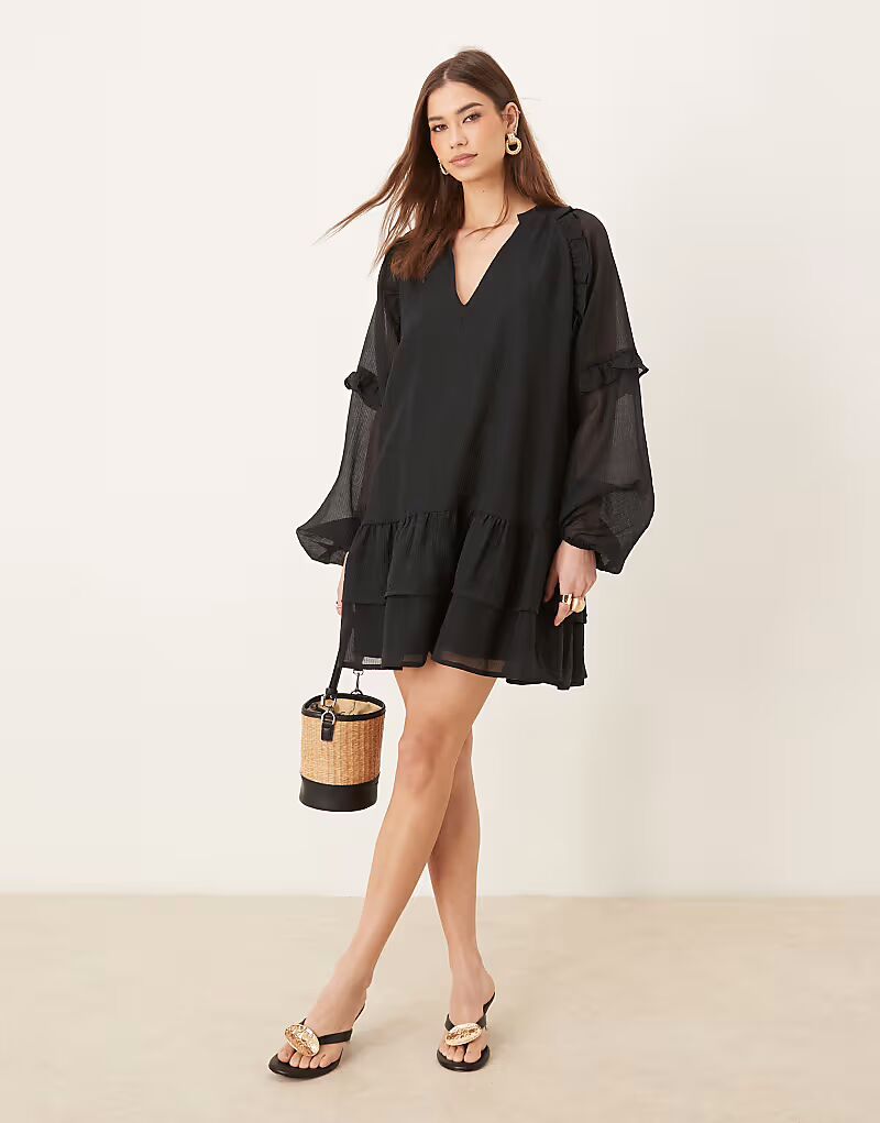 Pretty Lavish мини-платье с длинными рукавами и оборками черного цвета
Pretty Lavish мини-платье с длинными рукавами и оборками черного цвета