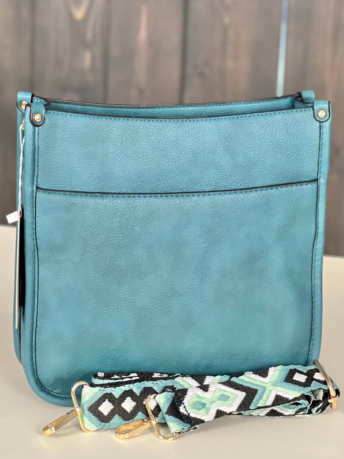 Женская сумка Posie через плечо с гитарным ремнем в павлиньем цвете Jen & Co., Peacock
Женская сумка Posie через плечо с гитарным ремнем в павлиньем цвете Jen & Co., Peacock