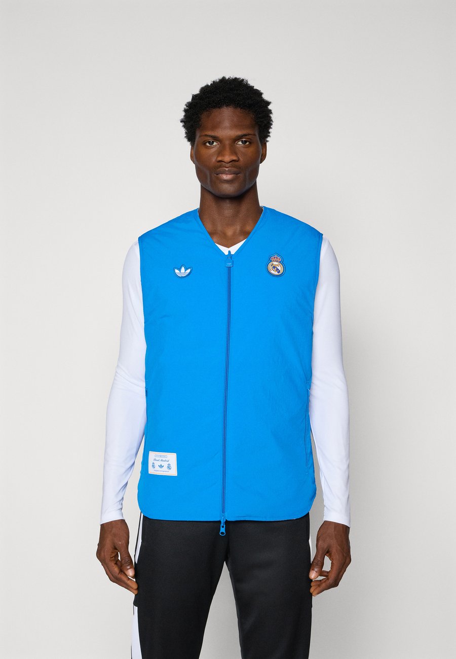 Куртка Adidas Originals REAL MADRID ICON VEST, Bluebird/White/Blue
Куртка Adidas Originals REAL MADRID ICON VEST, Bluebird/White/Blue