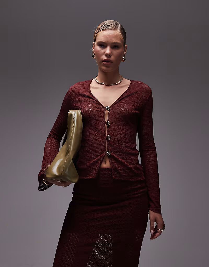 Кардиган ASOS DESIGN с расклешенными рукавами, связанный крючком, с золотыми пуговицами, бордового цвета
Кардиган ASOS DESIGN с расклешенными рукавами, связанный крючком, с золотыми пуговицами, бордового цвета