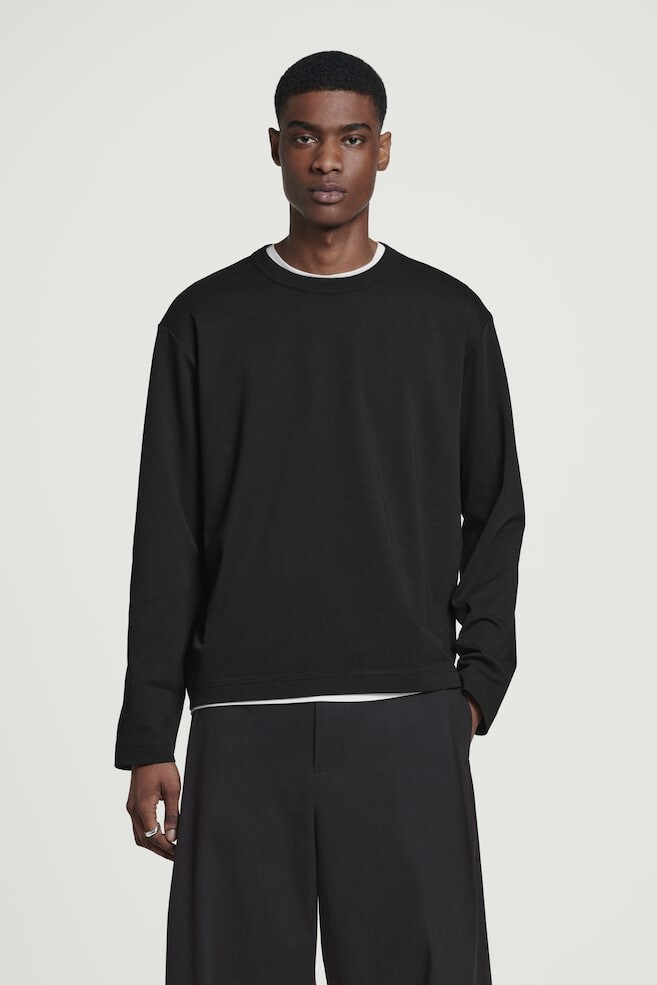 Свободная рубашка с длинными рукавами из хлопчатобумажного трикотажа Cos, черный
Свободная рубашка с длинными рукавами из хлопчатобумажного трикотажа Cos, черный