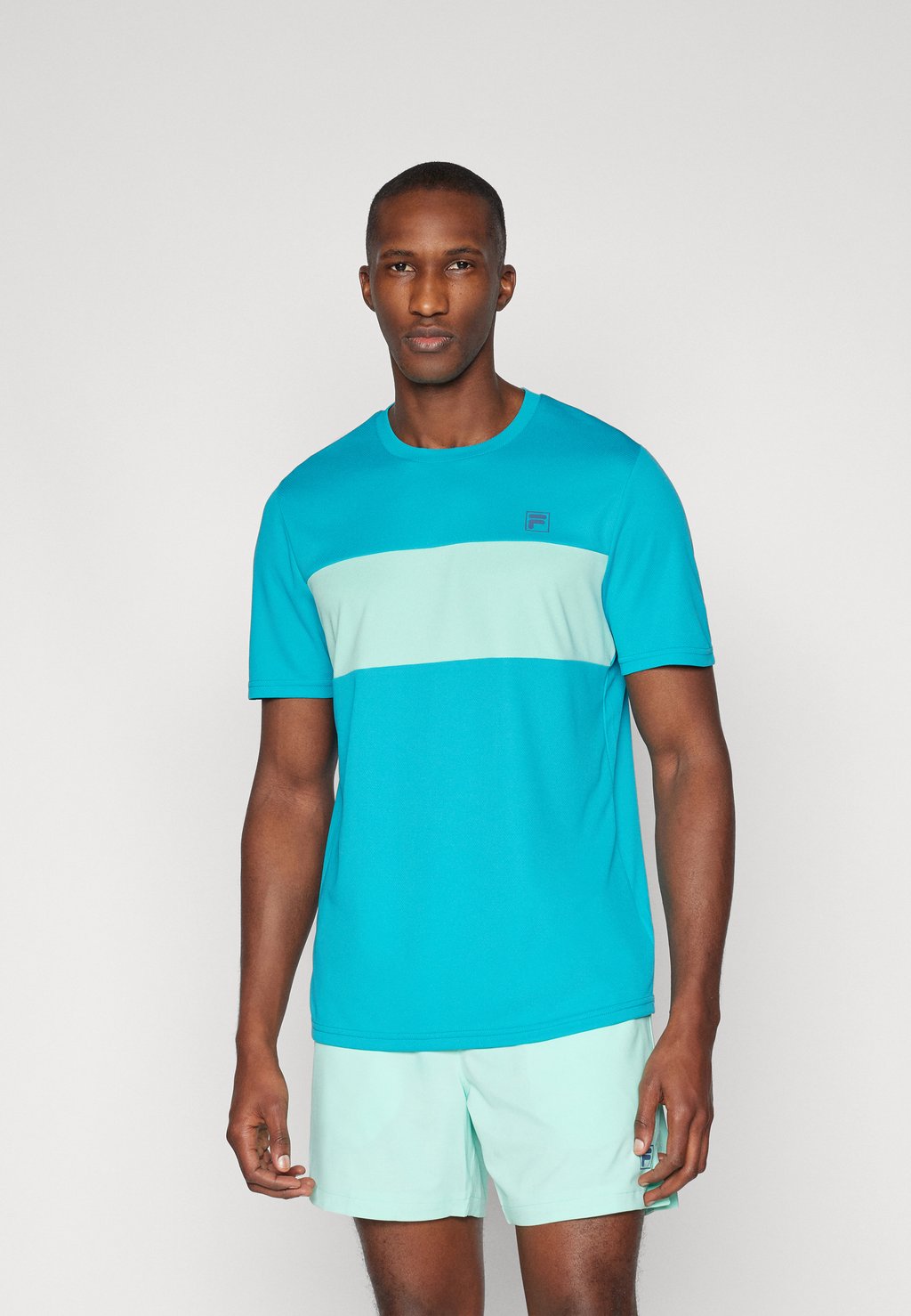 Спортивная футболка CAILAN Fila, сине-зеленый
Спортивная футболка CAILAN Fila, сине-зеленый