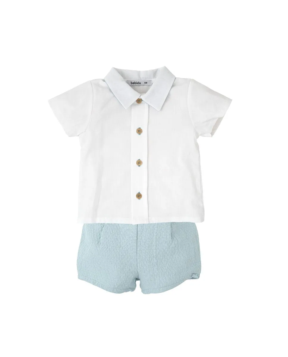 Детский комплект из белой рубашки и голубых шорт Babidú, белый/синий
Детский комплект из белой рубашки и голубых шорт Babidú, белый/синий