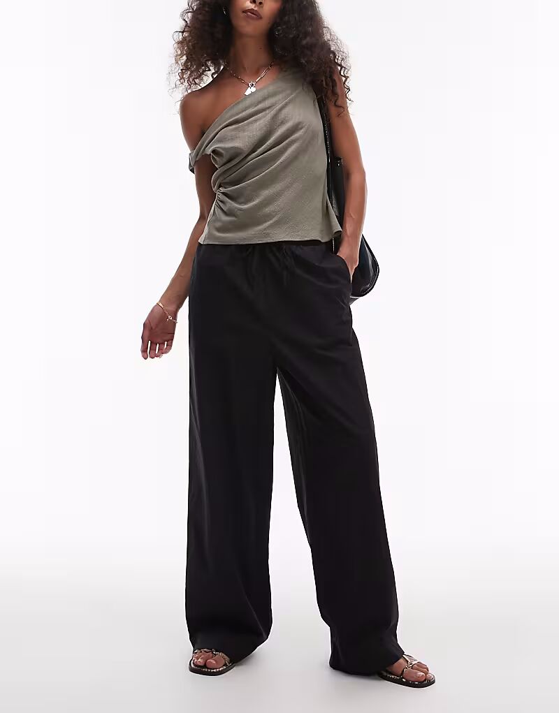 Брюки Rhythm Posie, собранные в черный цвет
Брюки Rhythm Posie, собранные в черный цвет