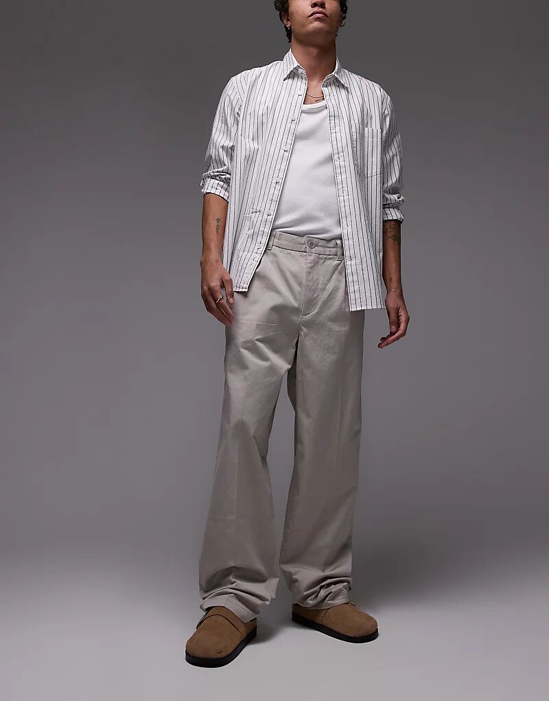 Свободные хлопковые брюки-чинос ARKET цвета темного камня
Свободные хлопковые брюки-чинос ARKET цвета темного камня