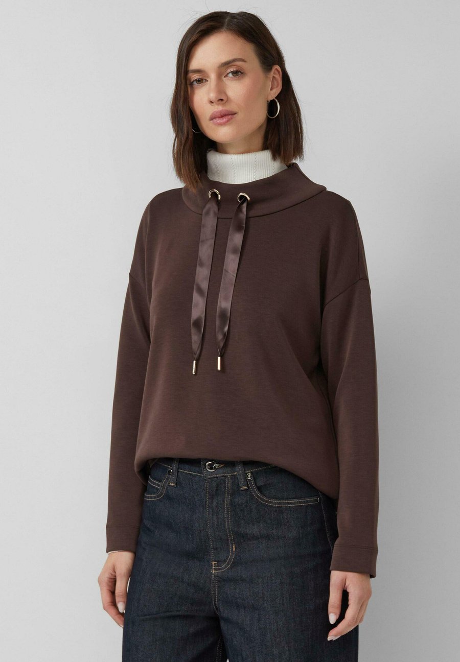 Топ s.Oliver Long sleeved top, Dunkelbraun/Brown
Топ s.Oliver Long sleeved top, Dunkelbraun/Brown