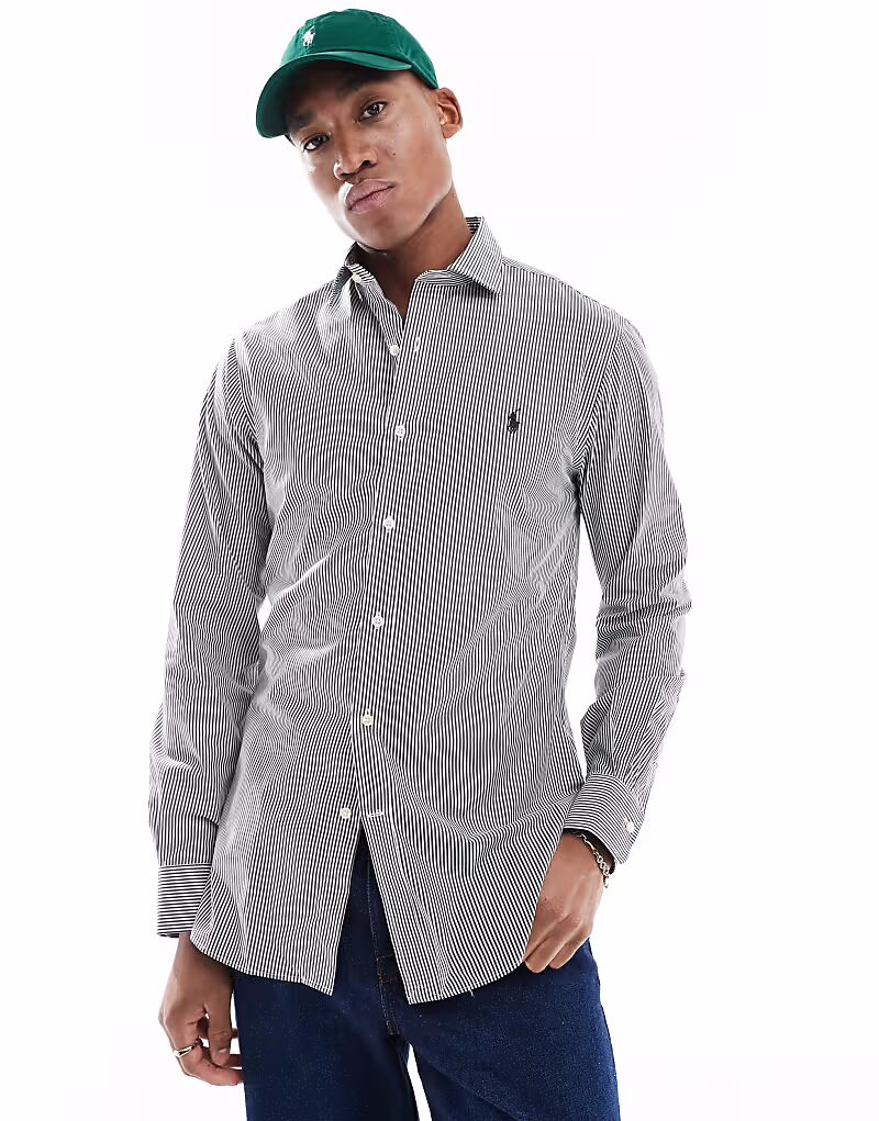 Рубашка Polo Ralph Lauren из поплина в полоску, облегающего кроя, с логотипом и воротником-стойкой, черно-белого цвета
Рубашка Polo Ralph Lauren из поплина в полоску, облегающего кроя, с логотипом и воротником-стойкой, черно-белого цвета