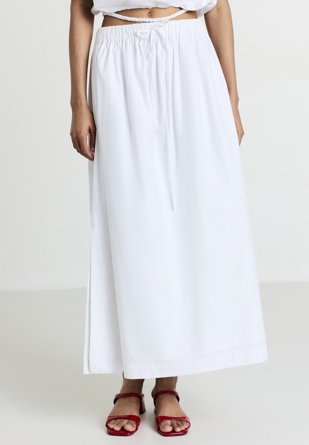 Юбка макси LUNGA SPACCHI LATERALI Calliope, кремовый 
Юбка макси LUNGA SPACCHI LATERALI Calliope, кремовый