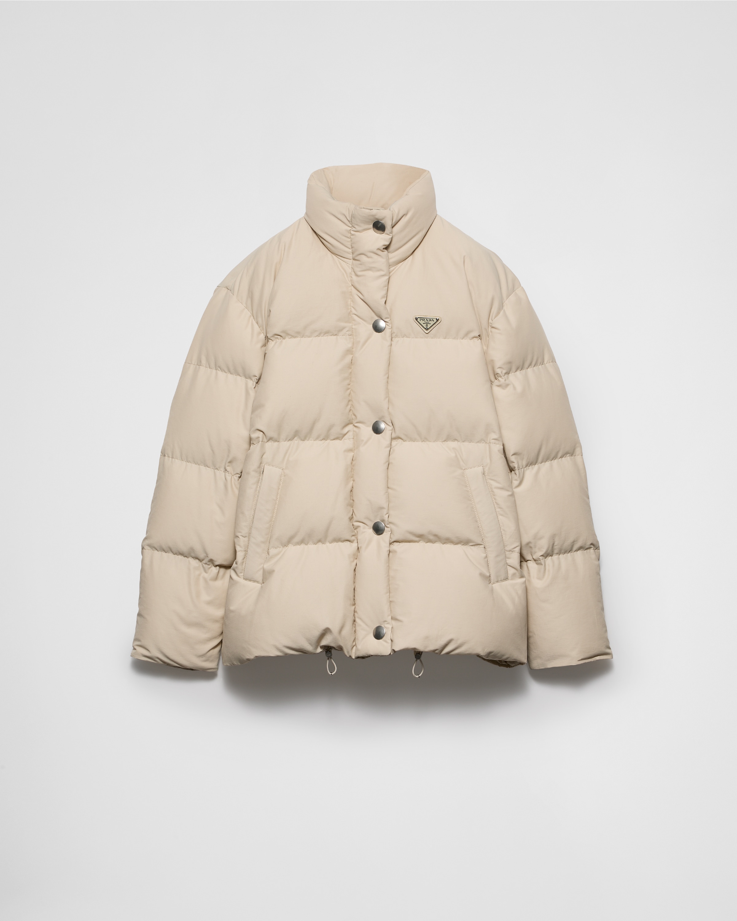 Пуховик из технической ткани Prada, песочный бежевый
Пуховик из технической ткани Prada, песочный бежевый