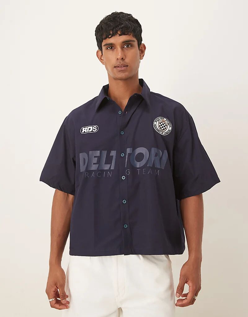 Рубашка свободного кроя ASOS DESIGN со спортивным принтом темно-синего цвета
Рубашка свободного кроя ASOS DESIGN со спортивным принтом темно-синего цвета