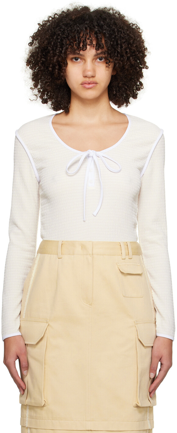 Кремового цвета футболка с длинными рукавами и морщинами на шее Генри Kijun
Кремового цвета футболка с длинными рукавами и морщинами на шее Генри Kijun