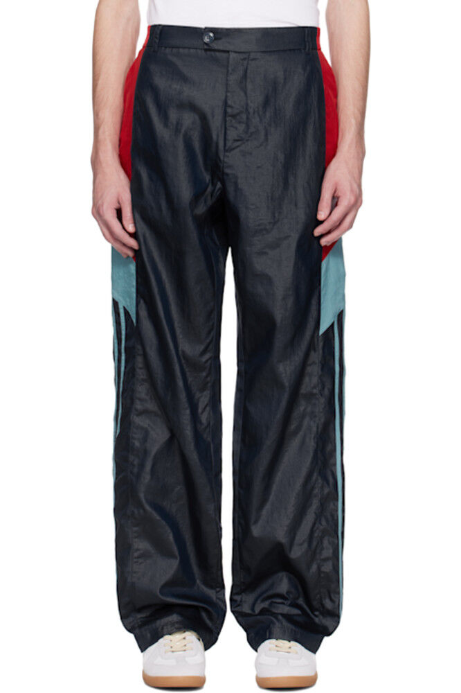 Спортивные брюки темно-синего цвета со вставками Martine Rose
Спортивные брюки темно-синего цвета со вставками Martine Rose