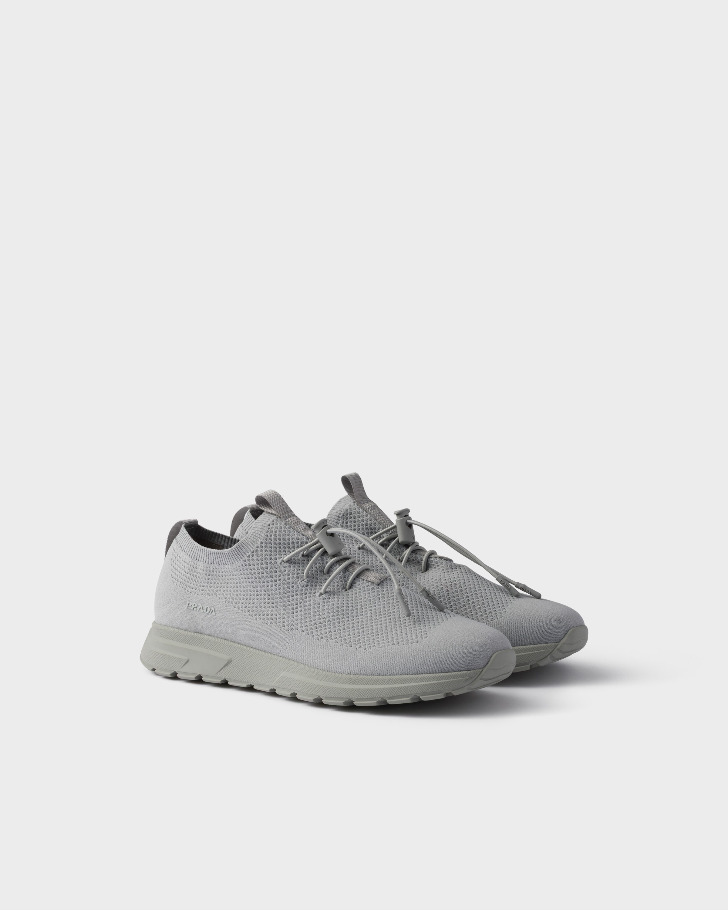 Кроссовки Prax из эластичного трикотажа Prada, серый
Кроссовки Prax из эластичного трикотажа Prada, серый
