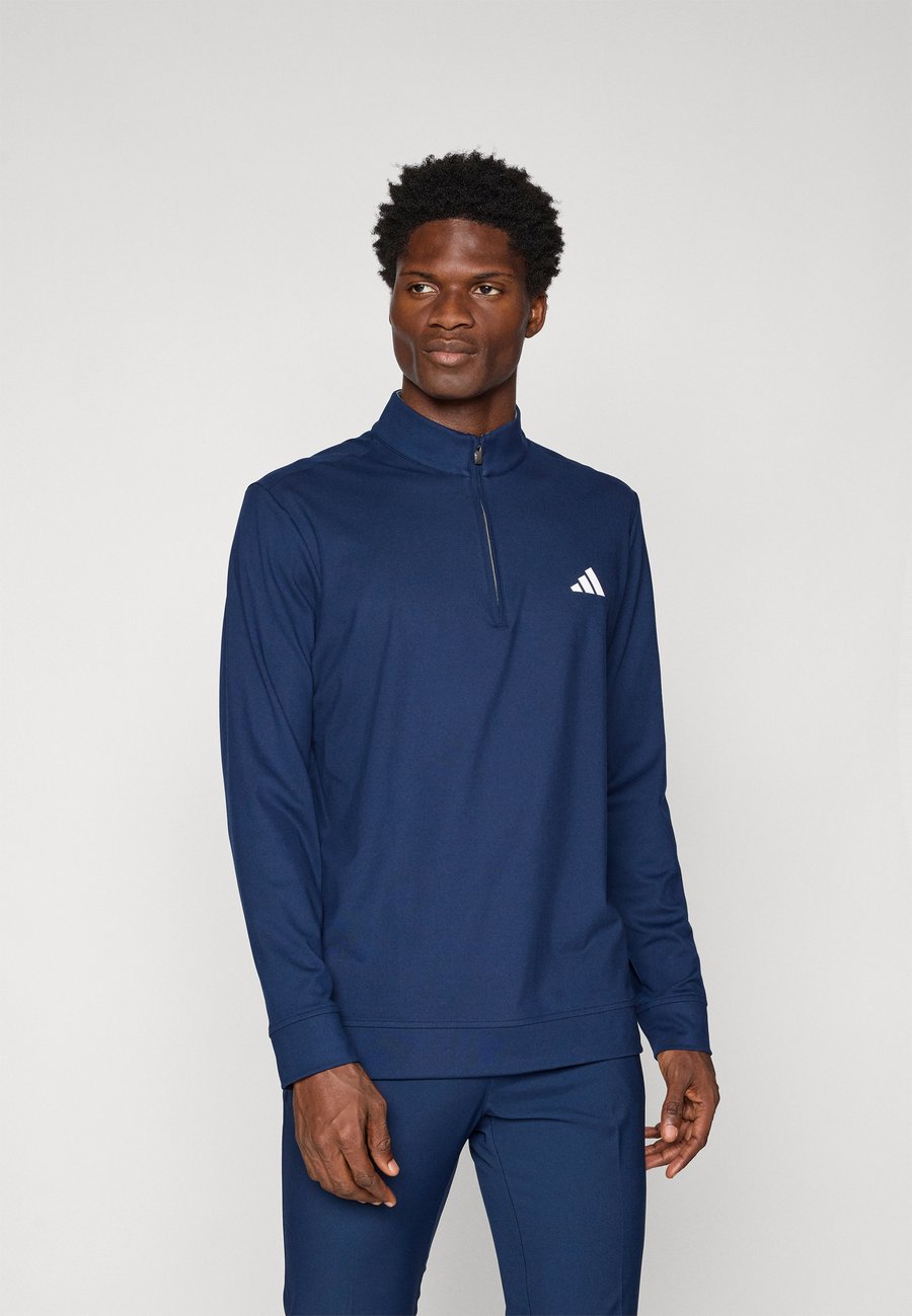Топ Adidas Golf ULTIMATE365 CLASSIC QUARTER ZIP, Conavy/Dark Blue
Топ Adidas Golf ULTIMATE365 CLASSIC QUARTER ZIP, Conavy/Dark Blue