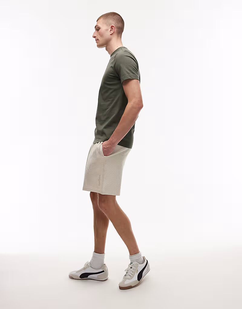 Пляжные шорты Tommy Jeans вафельного цвета бежевого цвета
Пляжные шорты Tommy Jeans вафельного цвета бежевого цвета