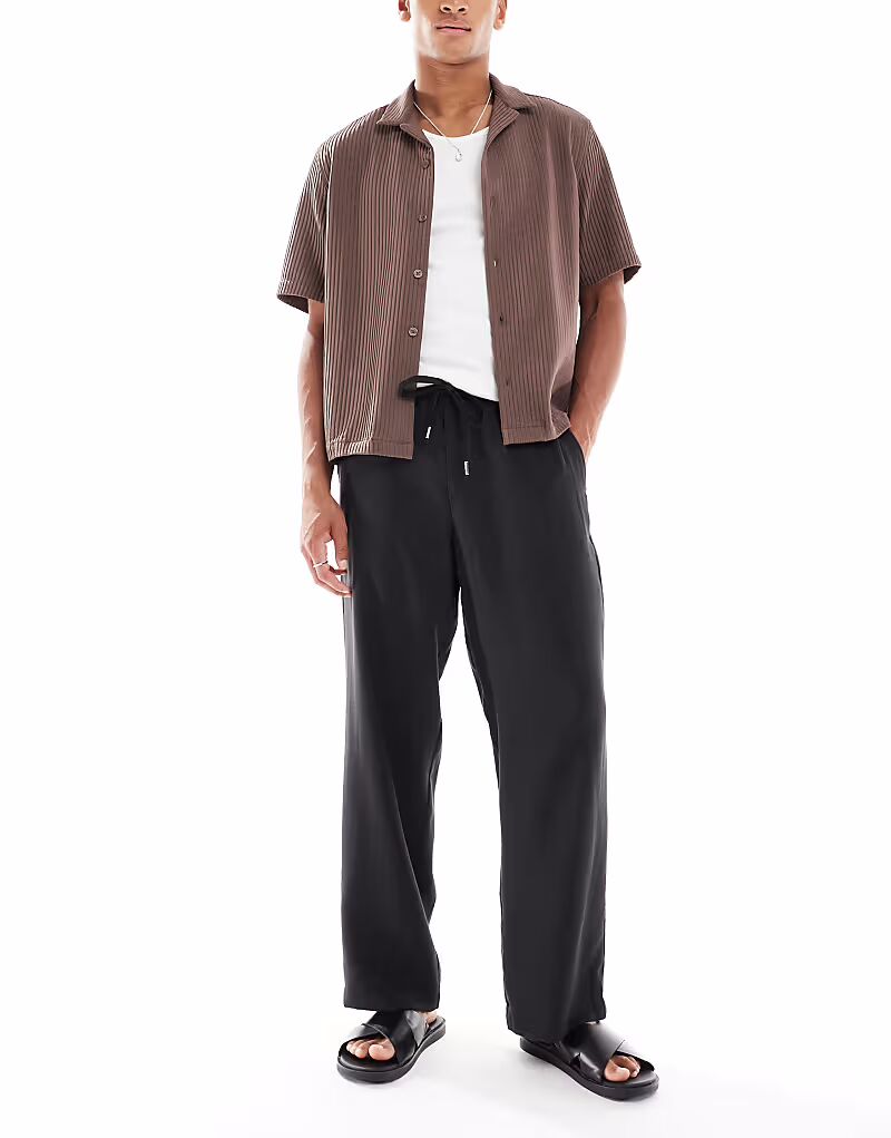 Широкие брюки с эластичным поясом ASOS DESIGN черного цвета
Широкие брюки с эластичным поясом ASOS DESIGN черного цвета