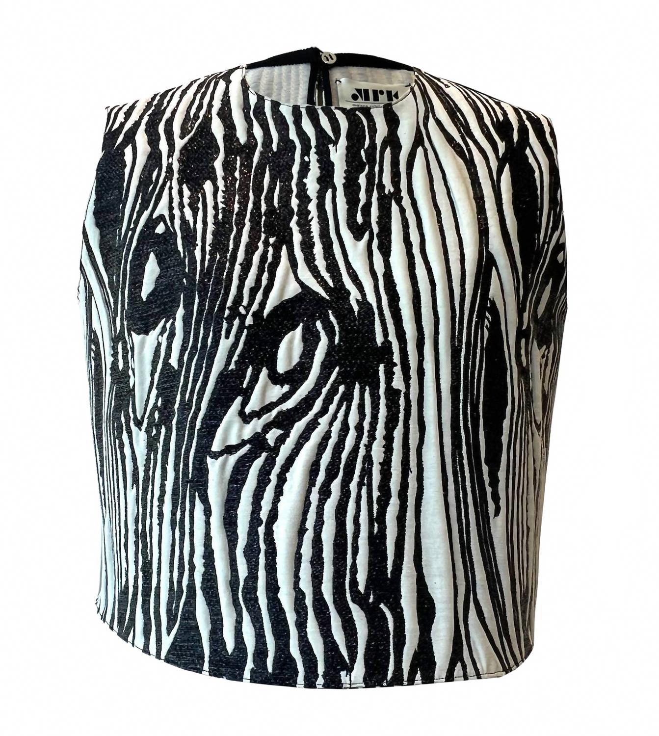 Женский топ без рукавов с люрексом в цвете слоновая кость/черный Maison Rabih Kayrouz
Женский топ без рукавов с люрексом в цвете слоновая кость/черный Maison Rabih Kayrouz