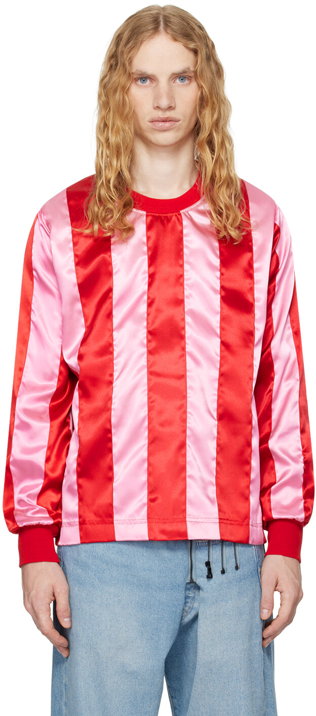 Эксклюзивная футболка SSENSE с красными и розовыми полосками Adam Jones
Эксклюзивная футболка SSENSE с красными и розовыми полосками Adam Jones