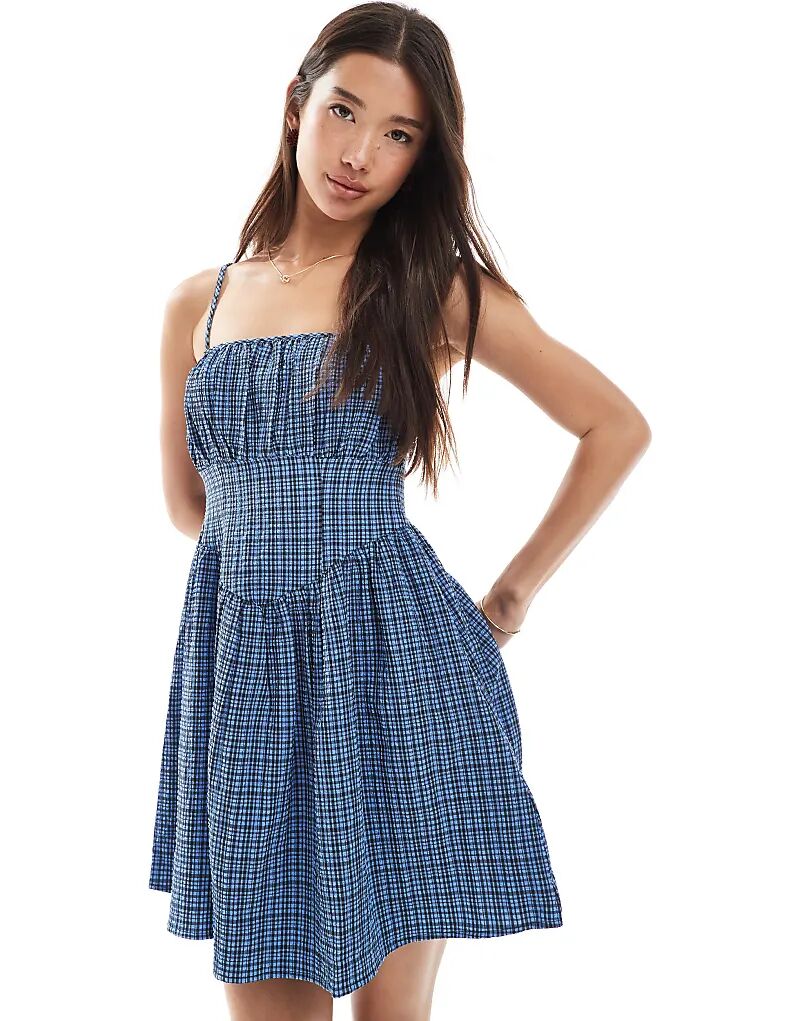 Мини-платье New Look Milkmaid с рюшами спереди в синюю клетку
Мини-платье New Look Milkmaid с рюшами спереди в синюю клетку