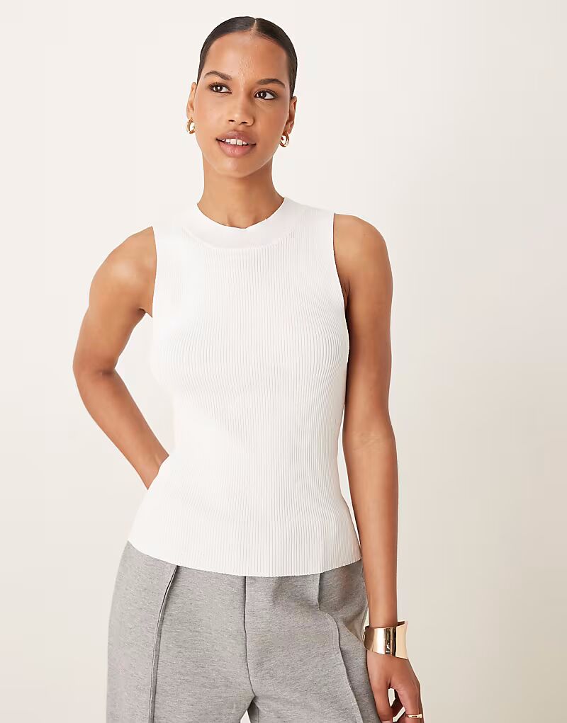 Белый трикотажный топ без рукавов с высоким воротом Mango
Белый трикотажный топ без рукавов с высоким воротом Mango