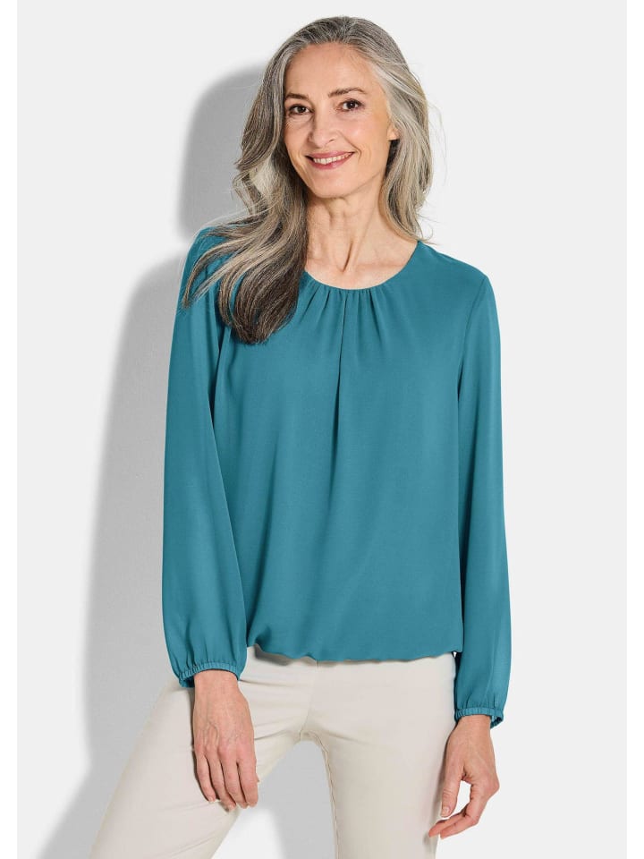 Элегантная шифоновая блузка цвета петроль GOLDNER
Элегантная шифоновая блузка цвета петроль GOLDNER