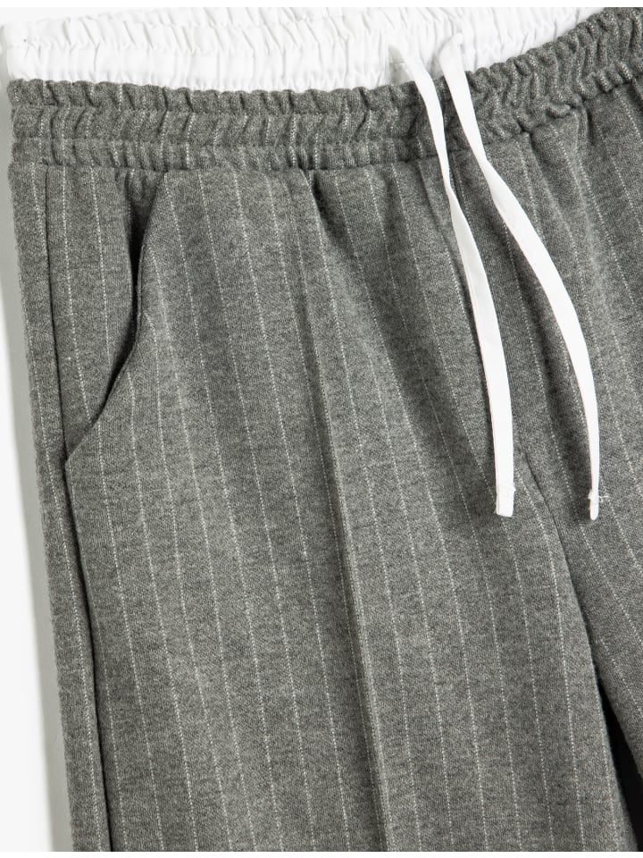 KOTON Серые полосатые брюки
KOTON Серые полосатые брюки