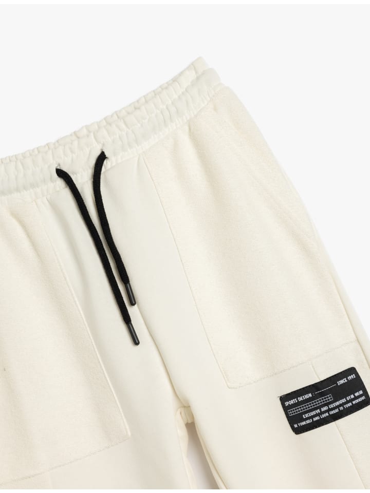 Спортивные брюки цвета экрю KOTON
Спортивные брюки цвета экрю KOTON