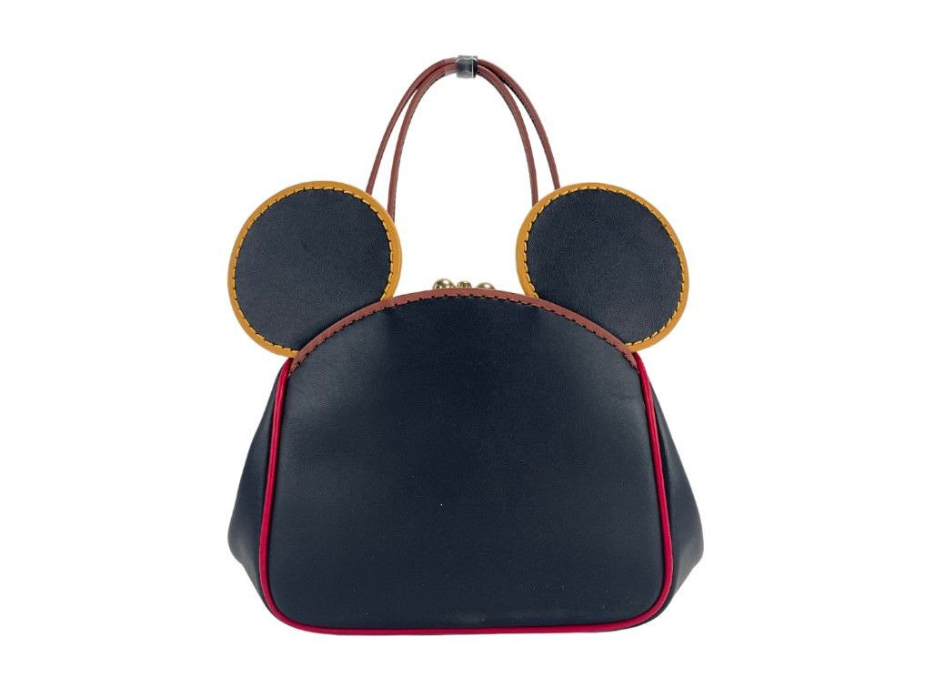 Маленькая кожаная сумка через плечо Kisslock от Микки Мауса и Кита Харинга Coach
Маленькая кожаная сумка через плечо Kisslock от Микки Мауса и Кита Харинга Coach