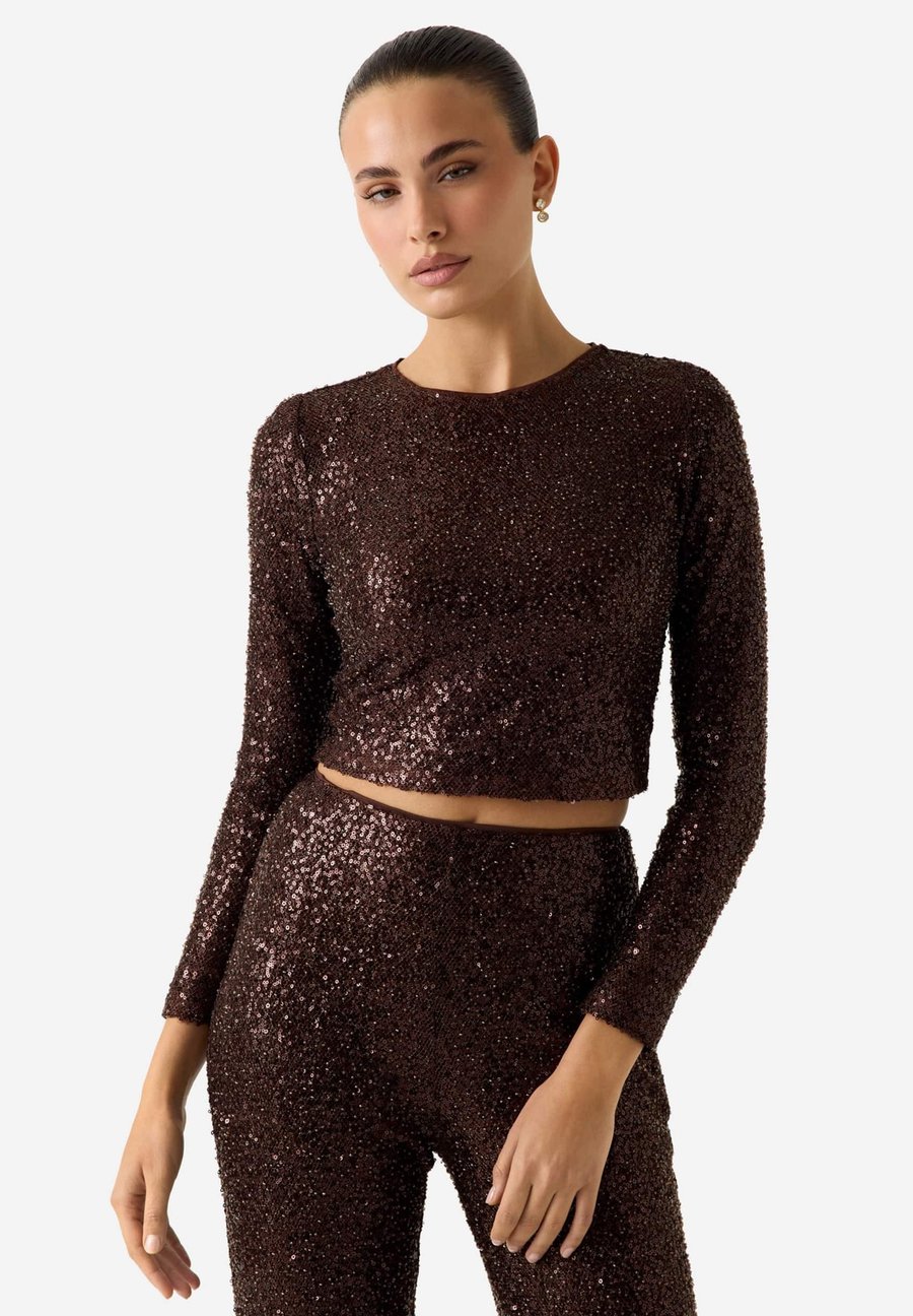 Блуза Guess PAILLETTEN-CROP, Mehrfarbig/Braun/Multi-Coloured
Блуза Guess PAILLETTEN-CROP, Mehrfarbig/Braun/Multi-Coloured