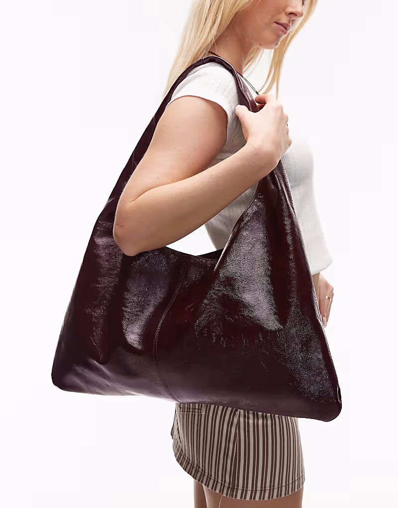 Большая блестящая сумка-тоут ARKET из натуральной кожи бордового цвета
Большая блестящая сумка-тоут ARKET из натуральной кожи бордового цвета