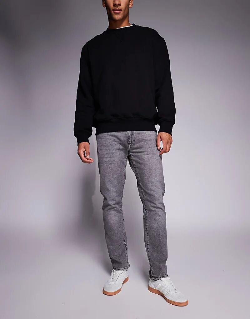 Зауженные джинсы Levi's 502 серого цвета
Зауженные джинсы Levi's 502 серого цвета