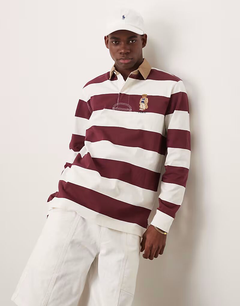 Поло для регби Polo Ralph Lauren Heritage с полосками и логотипом медведя в бордово-белом цвете
Поло для регби Polo Ralph Lauren Heritage с полосками и логотипом медведя в бордово-белом цвете