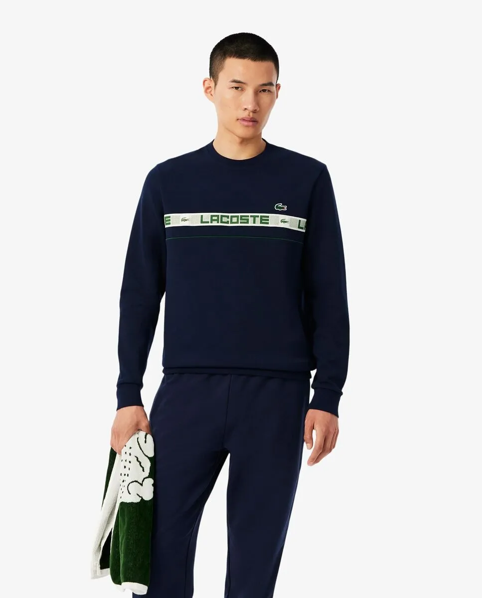 Мужская теннисная толстовка в полоску с черными фирменными деталями Lacoste
Мужская теннисная толстовка в полоску с черными фирменными деталями Lacoste